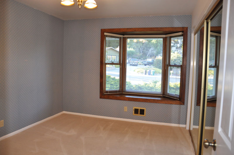 Two bedrooms both with bay windows and mirror sliding doors to closets